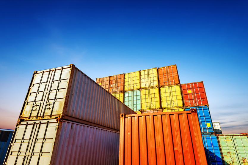 Colorful containers against a blue sky