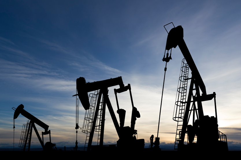 Oil rigs during sunset symbolizes petroleum and Motor Fuels; Source: istockphoto.com/David Jones